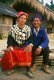 China: A Kachin couple outside their house, Dehong Dai and Jingpo Autonomous Prefecture, southwest China
